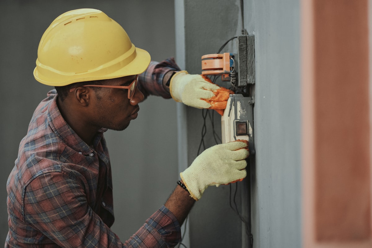 Electrician working on wiring and fittings