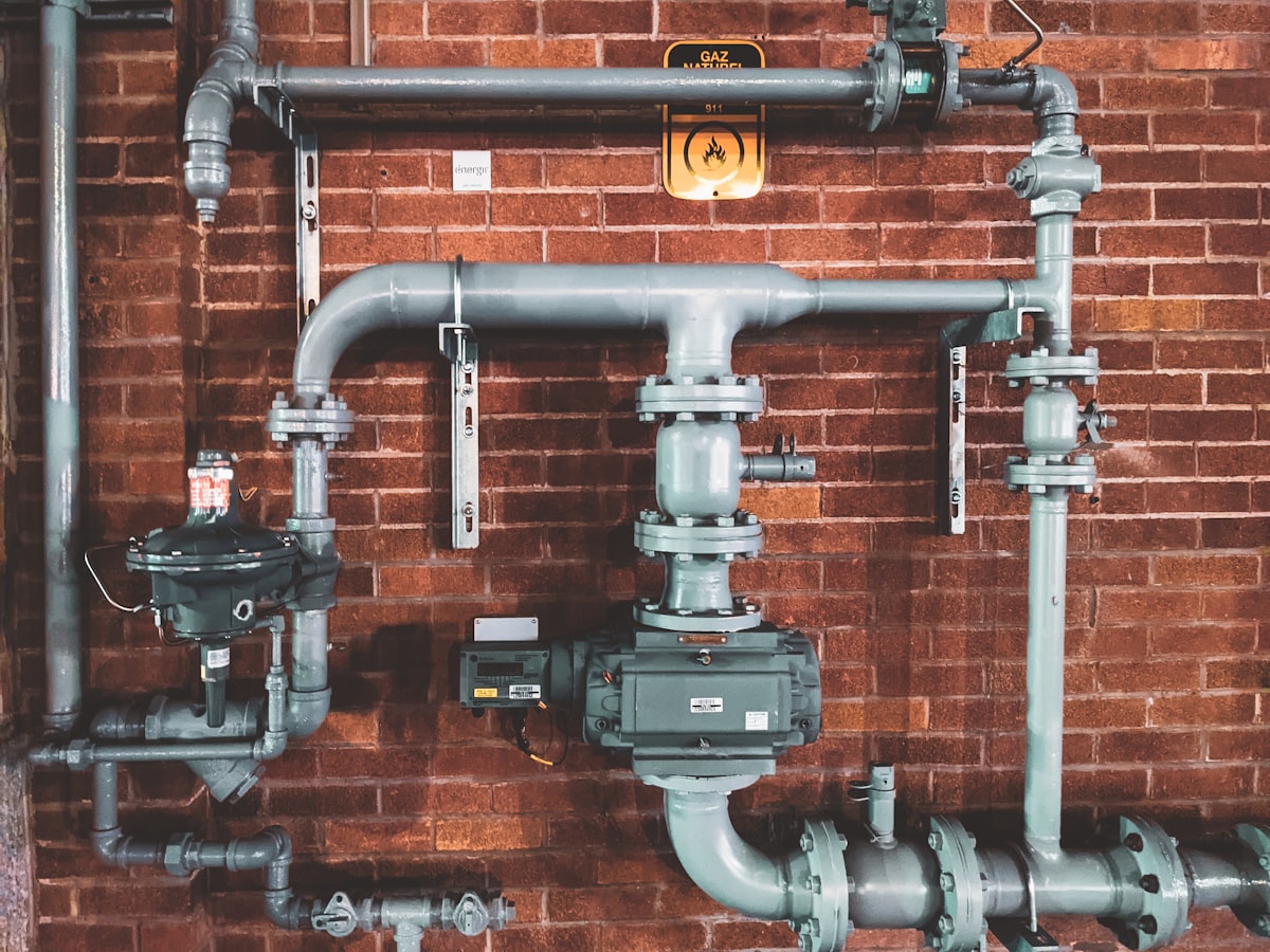 Plumber handling pipes and fittings